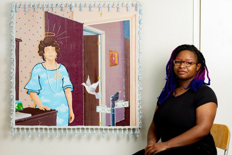 Artist Marie-José alongside their artwork